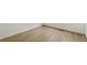 A clean bedroom with wood flooring, a vent, and plain white walls at 6187 E 155Th Pl, Thornton, CO 80602