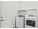 A functional laundry area with a washer and dryer, and a modern design at 6187 E 155Th Pl, Thornton, CO 80602