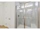 Shower with a glass door and tile at 6187 E 155Th Pl, Thornton, CO 80602