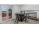 Inviting dining area with a sliding door to the outside and a view of the kitchen at 12160 Birch St, Thornton, CO 80241