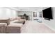 Spacious basement with a comfortable sectional sofa and a workout area with exercise equipment at 140 Race St, Denver, CO 80206