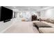 The basement has a large TV, sectional sofa, and a designated play area for children at 140 Race St, Denver, CO 80206