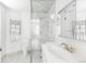 Bright bathroom with a glass shower, marble-like tiling, and modern fixtures at 140 Race St, Denver, CO 80206