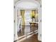 Sun-drenched entryway with hardwood floors and an elegant round table at 140 Race St, Denver, CO 80206