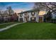 Charming two-story home with a lush green lawn at 140 Race St, Denver, CO 80206