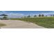 Open green space with a fence line, picnic benches and shade structure in a community at 11029 Snowdon St, Parker, CO 80134