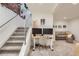 Basement with carpeted stairs, a workstation, and additional seating at 1217 E 26Th Ave, Denver, CO 80205