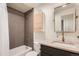 Bathroom with modern finishes features a bathtub, shower and stylish vanity at 1217 E 26Th Ave, Denver, CO 80205