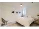 Bedroom with neutral carpet, double bed, window and decorative pictures at 1217 E 26Th Ave, Denver, CO 80205
