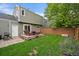 The wooden deck offers seating around a fire pit, and a grassy area for activities at 4720 S Dudley St # 44, Littleton, CO 80123