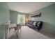 Bright bedroom features desk, couch, and a large window for natural light at 4720 S Dudley St # 44, Littleton, CO 80123