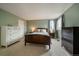 Spacious bedroom features plush carpeting, dresser storage, and natural light from the windows at 4720 S Dudley St # 44, Littleton, CO 80123