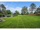 Community green space featuring a picnic bench and mature trees at 4720 S Dudley St # 44, Littleton, CO 80123