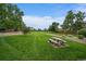 Expansive community green space features picnic benches and mature trees at 4720 S Dudley St # 44, Littleton, CO 80123