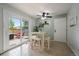 Bright dining area with sliding glass door to the deck and backyard at 4720 S Dudley St # 44, Littleton, CO 80123