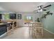 Eat in kitchen with a slider to the backyard deck area, tiled floors, and lots of natural light at 4720 S Dudley St # 44, Littleton, CO 80123