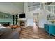 Inviting living room with a cozy fireplace, built in shelving, and views to the second story at 4720 S Dudley St # 44, Littleton, CO 80123