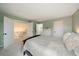 This bedroom features soft, neutral walls, carpet, and bright, natural light at 4720 S Dudley St # 44, Littleton, CO 80123