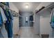 Spacious walk-in closet featuring carpeted floor, ample shelving, and closet rods for optimal storage and organization at 4720 S Dudley St # 44, Littleton, CO 80123