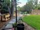 Landscaped backyard with fire pit, patio, and raised garden beds at 6087 S Westview St, Littleton, CO 80120