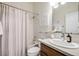 Bathroom featuring a shower-tub, toilet, vanity, and neutral color scheme at 2777 Ironton St, Denver, CO 80238