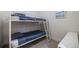 Bedroom features bunk beds with a carpeted floor, a white nightstand and a bright painting at 2777 Ironton St, Denver, CO 80238