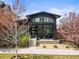 Charming single-Gathering home featuring a minimalist modern design and welcoming front porch in a landscaped yard at 2777 Ironton St, Denver, CO 80238