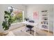 Bright office space featuring a large window, modern desk, and stylish decor, creating an inviting workspace at 2777 Ironton St, Denver, CO 80238