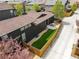 Modern home showcasing a well-manicured backyard with artificial turf, a patio, and a charming wooden fence at 2777 Ironton St, Denver, CO 80238