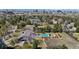 Scenic aerial view of a home surrounded by trees with an in-ground pool at 9505 Poundstone Pl, Greenwood Village, CO 80111