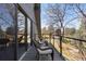 View of balcony with chairs and railing showcasing outdoor living and architectural details at 9505 Poundstone Pl, Greenwood Village, CO 80111