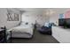 Bedroom with a bed, beanbag chair, dresser, and a window with a view at 9505 Poundstone Pl, Greenwood Village, CO 80111