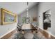 Dining room with extra long table, bright window, and modern light fixture at 9505 Poundstone Pl, Greenwood Village, CO 80111