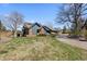 Charming home with stone accents, a lush lawn, and a welcoming driveway at 9505 Poundstone Pl, Greenwood Village, CO 80111