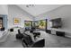 Spacious living room with vaulted ceilings, access to a patio, and comfortable seating at 9505 Poundstone Pl, Greenwood Village, CO 80111