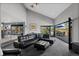 Open living room with access to outdoor patio seating and views of the yard at 9505 Poundstone Pl, Greenwood Village, CO 80111