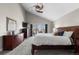 Bright main bedroom with a large bed, balcony, and ample storage space offers a comfortable retreat at 9505 Poundstone Pl, Greenwood Village, CO 80111