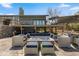 A charming patio with comfortable seating and a fire pit creates an inviting outdoor living space at 9505 Poundstone Pl, Greenwood Village, CO 80111