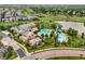 Community center aerial view with swimming pools, playgrounds, and surrounding neighborhood at 16256 Ute Peak Way, Broomfield, CO 80023