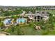 Aerial view of the community center featuring a pool, waterslide, and beautifully landscaped grounds at 16256 Ute Peak Way, Broomfield, CO 80023