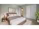 Spacious bedroom with a queen bed, closet, ensuite bath, neutral walls and lots of natural light at 16256 Ute Peak Way, Broomfield, CO 80023