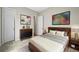 Bedroom with modern furniture, stylish wall art, and neutral-toned bedding at 16256 Ute Peak Way, Broomfield, CO 80023