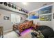Teen bedroom featuring unique aviation decor, carpet, neutral walls, recessed lighting and a dark beanbag chair at 16256 Ute Peak Way, Broomfield, CO 80023