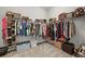 Walk-in closet with ample storage and organized shelving for clothes and accessories at 16256 Ute Peak Way, Broomfield, CO 80023