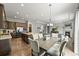 Open floor plan connects the kitchen, dining, and living areas, ideal for modern living and entertaining guests with ease at 16256 Ute Peak Way, Broomfield, CO 80023