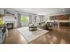 Spacious living area boasts hardwood floors, abundant natural light, a cozy fireplace, and an open layout perfect for gathering at 16256 Ute Peak Way, Broomfield, CO 80023