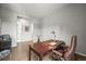 Spacious home office featuring hardwood floors, desk, and a comfortable executive chair at 16256 Ute Peak Way, Broomfield, CO 80023