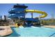 Resort-style waterpark featuring a waterslide, inviting pools, and ample space for relaxation at 16256 Ute Peak Way, Broomfield, CO 80023
