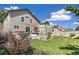 Spacious backyard with patio area, pergola seating, a storage shed, and a lush green lawn at 4150 S Rome St, Aurora, CO 80018