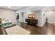 Finished basement featuring wood flooring, an entertainment center, and an adjacent bathroom at 4150 S Rome St, Aurora, CO 80018